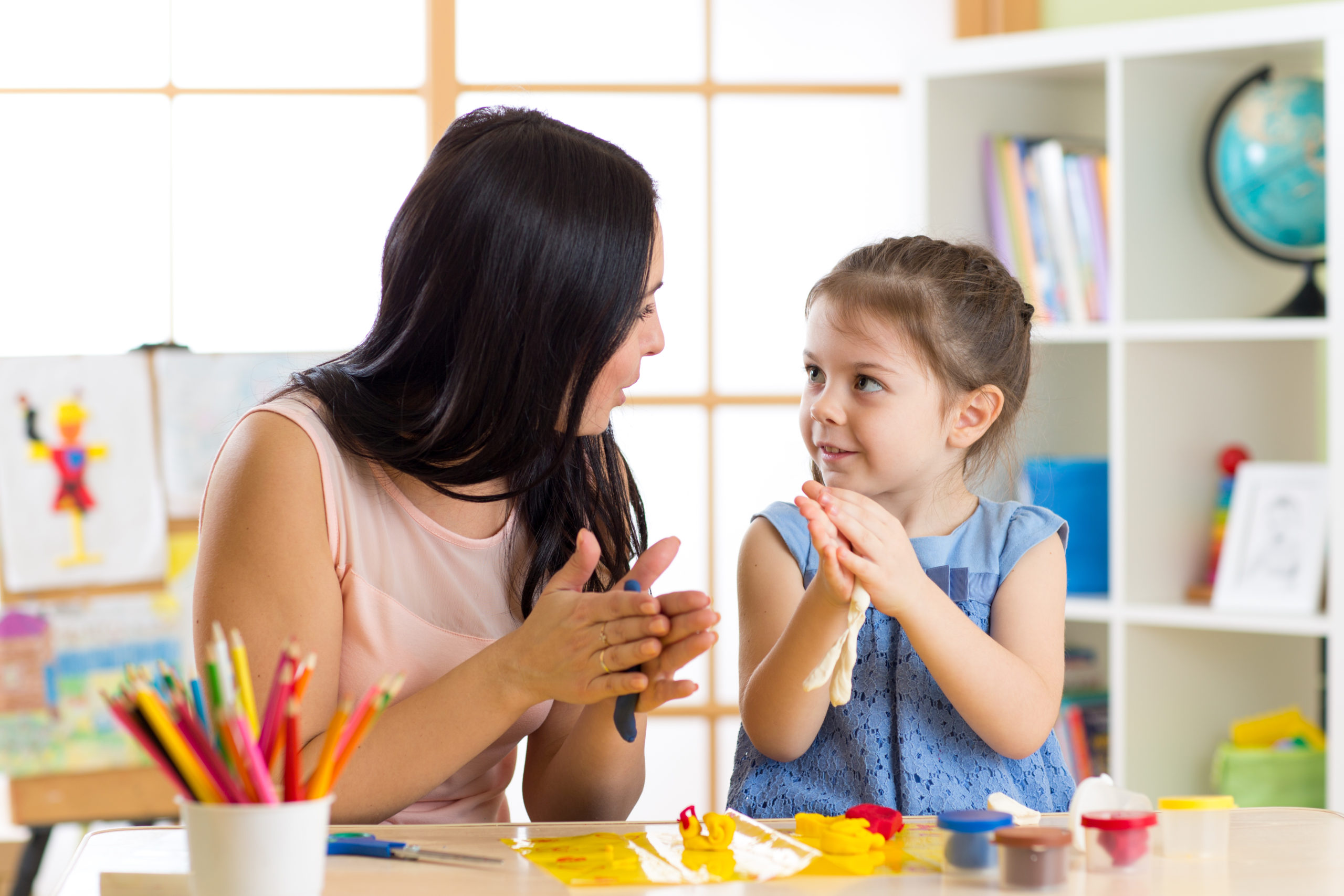 Young,Mother,And,Her,Child,Daughter,Moulding,Together,From,Plasticine